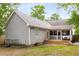 Charming home exterior featuring a screened porch, deck, and string lights, perfect for outdoor living at 764 Stokeswood Se Ave, Atlanta, GA 30316
