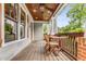 Inviting front porch with stained wood ceiling, recessed lights and outdoor seating at 764 Stokeswood Se Ave, Atlanta, GA 30316