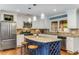 Beautiful kitchen features a blue island with granite countertops, stainless appliances, and hardwood floors at 764 Stokeswood Se Ave, Atlanta, GA 30316
