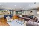 Open-concept living space with hardwood floors seamlessly flowing into the gourmet kitchen at 764 Stokeswood Se Ave, Atlanta, GA 30316