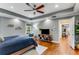 Spacious main bedroom with a trey ceiling, hardwood floors, and a large TV at 764 Stokeswood Se Ave, Atlanta, GA 30316