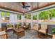 Relaxing screened porch with wood ceiling, furnished with comfortable seating and views of the private backyard at 764 Stokeswood Se Ave, Atlanta, GA 30316