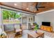 Inviting screened porch featuring a ceiling fan and ample seating, perfect for enjoying the outdoors in comfort at 764 Stokeswood Se Ave, Atlanta, GA 30316