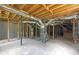 Unfinished basement with concrete floor, exposed beams, and HVAC system, offering potential for customization and additional living space at 1641 Rockcliff Se Pl, Atlanta, GA 30316