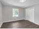 Bedroom with light gray walls, closet, and hardwood flooring at 1641 Rockcliff Se Pl, Atlanta, GA 30316