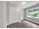 Bedroom featuring wood-look floors, closet, and a large window at 1641 Rockcliff Se Pl, Atlanta, GA 30316