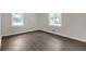 Bedroom featuring wood-look floors, and a large window at 1641 Rockcliff Se Pl, Atlanta, GA 30316