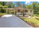 Charming home featuring a covered carport, stone accents, landscaped yard, and concrete driveway at 1641 Rockcliff Se Pl, Atlanta, GA 30316