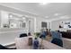 Bright, open-concept living room with modern furnishings and stylish decor flows into dining and kitchen at 1641 Rockcliff Se Pl, Atlanta, GA 30316