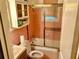 Small, pink-tiled bathroom features a shower-tub combo and a vanity at 1968 Don Juan Ln, Decatur, GA 30032