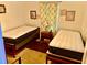 Bedroom furnished with two twin beds, floral curtains, and a nightstand at 1968 Don Juan Ln, Decatur, GA 30032
