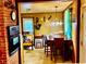 Cozy dining area with wood-paneled walls and a view of an oven and an adjacent room at 1968 Don Juan Ln, Decatur, GA 30032