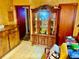Dining room with wood paneled walls and a large china cabinet at 1968 Don Juan Ln, Decatur, GA 30032