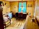 Dining area features wooden table, chairs, and a yellow paneled wall at 1968 Don Juan Ln, Decatur, GA 30032