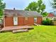 The house has a brick exterior with a patio and a small yard, and mature trees at 1968 Don Juan Ln, Decatur, GA 30032