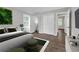 Bright bedroom with hardwood flooring, ensuite bathroom access, and dual closets at 2683 Rockcliff Se Rd, Atlanta, GA 30316