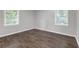 Bright bedroom with hardwood floors and two windows, perfect for a cozy retreat at 2683 Rockcliff Se Rd, Atlanta, GA 30316