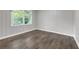Clean bedroom with neutral tones, wood paneling, hardwood floors and natural light at 2683 Rockcliff Se Rd, Atlanta, GA 30316