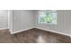 Bedroom featuring neutral tones, wood paneling, hardwood floors and natural light at 2683 Rockcliff Se Rd, Atlanta, GA 30316