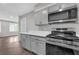 Modern kitchen featuring stainless steel appliances, gray cabinetry, and white countertops at 2683 Rockcliff Se Rd, Atlanta, GA 30316