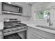 Bright kitchen showcasing modern appliances, light countertops, and plenty of natural light at 2683 Rockcliff Se Rd, Atlanta, GA 30316
