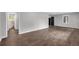 Bright living room featuring updated flooring, neutral walls, and doorways leading to other rooms at 2683 Rockcliff Se Rd, Atlanta, GA 30316