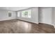 A bright living room showcasing stylish flooring, fresh paint, and ample natural light from large windows at 2683 Rockcliff Se Rd, Atlanta, GA 30316