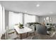 Open-concept living room and dining area with bright natural light and stylish contemporary furnishings at 2683 Rockcliff Se Rd, Atlanta, GA 30316