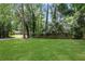 Spacious backyard featuring a lush lawn and privacy fence at 3093 Del Monico Dr, Decatur, GA 30032