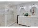 Modern bathroom featuring double sinks, glass shower, and decorative tile at 3093 Del Monico Dr, Decatur, GA 30032