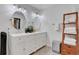 Bright bathroom features double sinks, ornate tile, and decorative ladder at 3093 Del Monico Dr, Decatur, GA 30032