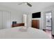 Bedroom with white walls, modern dresser, and view to bathroom at 3093 Del Monico Dr, Decatur, GA 30032