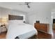 Well-lit bedroom with hardwood floors, midcentury dresser, and neutral decor at 3093 Del Monico Dr, Decatur, GA 30032