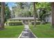 Attractive single-story home with well-manicured lawn and mature trees, offering great curb appeal at 3093 Del Monico Dr, Decatur, GA 30032