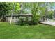 Inviting front exterior with lush lawn and a charming carport at 3093 Del Monico Dr, Decatur, GA 30032