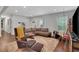 Open-concept living room with contemporary decor, plush seating, and ample space for relaxation at 3093 Del Monico Dr, Decatur, GA 30032