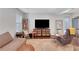 Comfortable living room featuring a large TV, stylish furnishings, and lots of natural light at 3093 Del Monico Dr, Decatur, GA 30032