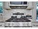 Close up of gas range and marble countertops at 3093 Del Monico Dr, Decatur, GA 30032