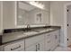 Stylish bathroom with double vanity featuring dark countertops and modern fixtures at 454 Connally Se St, Atlanta, GA 30312