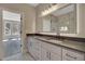 Bright bathroom with a double vanity, large mirror, and modern fixtures at 454 Connally Se St, Atlanta, GA 30312