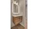 Modern bathroom featuring a wood vanity, mirror, and stylish lighting fixtures at 454 Connally Se St, Atlanta, GA 30312