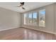 Spacious bedroom with hardwood floors and bright natural light from large windows at 454 Connally Se St, Atlanta, GA 30312