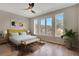 Bright bedroom with large windows, wood floors, and a comfortable bed at 454 Connally Se St, Atlanta, GA 30312