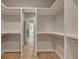 Walk-in closet with built-in shelving and plenty of storage space at 454 Connally Se St, Atlanta, GA 30312