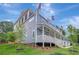 Multi-story townhouse with inviting porches, landscaping, and ample natural light at 454 Connally Se St, Atlanta, GA 30312