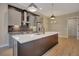 Spacious kitchen featuring an oversized island, stainless steel appliances, and modern backsplash at 454 Connally Se St, Atlanta, GA 30312