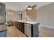 Stylish kitchen island with seating, stainless appliances, and modern pendant lights at 454 Connally Se St, Atlanta, GA 30312