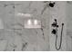 Modern marble shower with a rainfall showerhead and built-in shelving at 454 Connally Se St, Atlanta, GA 30312