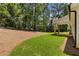 Expansive backyard featuring lush greenery and a partially wooded area, creating a private outdoor retreat at Lot 2 Harmony Rd, Temple, GA 30179