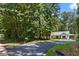 Charming single-story home surrounded by lush greenery with a newly paved driveway at Lot 2 Harmony Rd, Temple, GA 30179